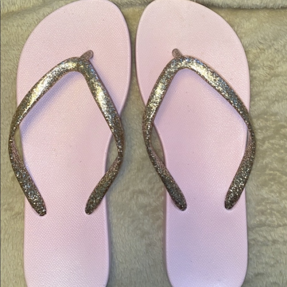 pink and gold strapped aero flip flops
